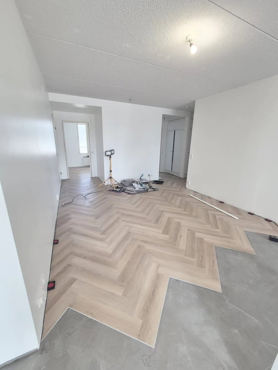Herringbone vinyl plank floor being installed in Helsinki
